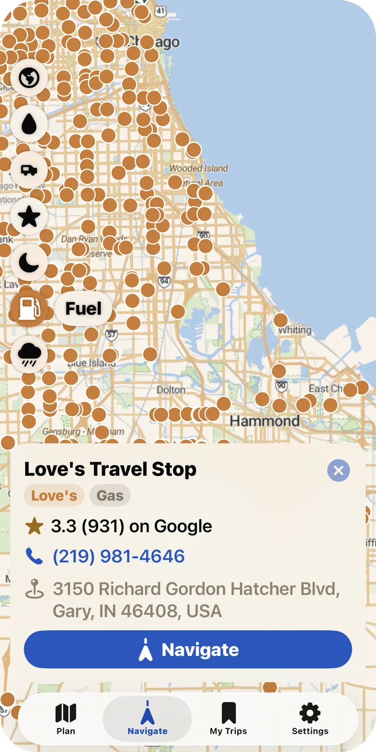 VistaBound Navigate screen showing the fuel-station map layer — hundreds of brand markers across the Chicago area — with a Love's Travel Stop detail card (brand tag, Google rating, phone, address, and a Navigate button).